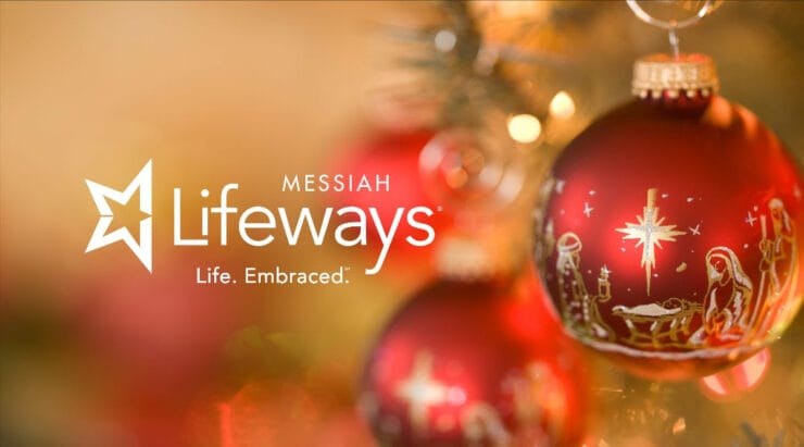 a messiah lifeways logo with a christmas ornament in the foreground