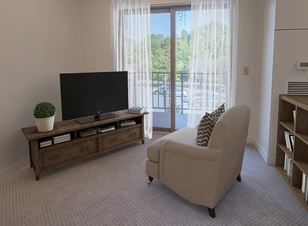 a living room with a chair and a flat screen tv